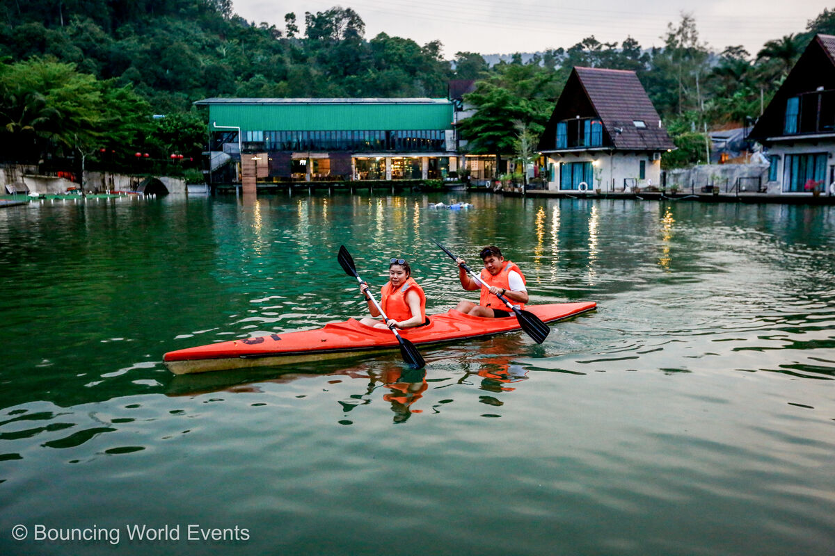 Afternoon on the lake: kayaks under the trees
